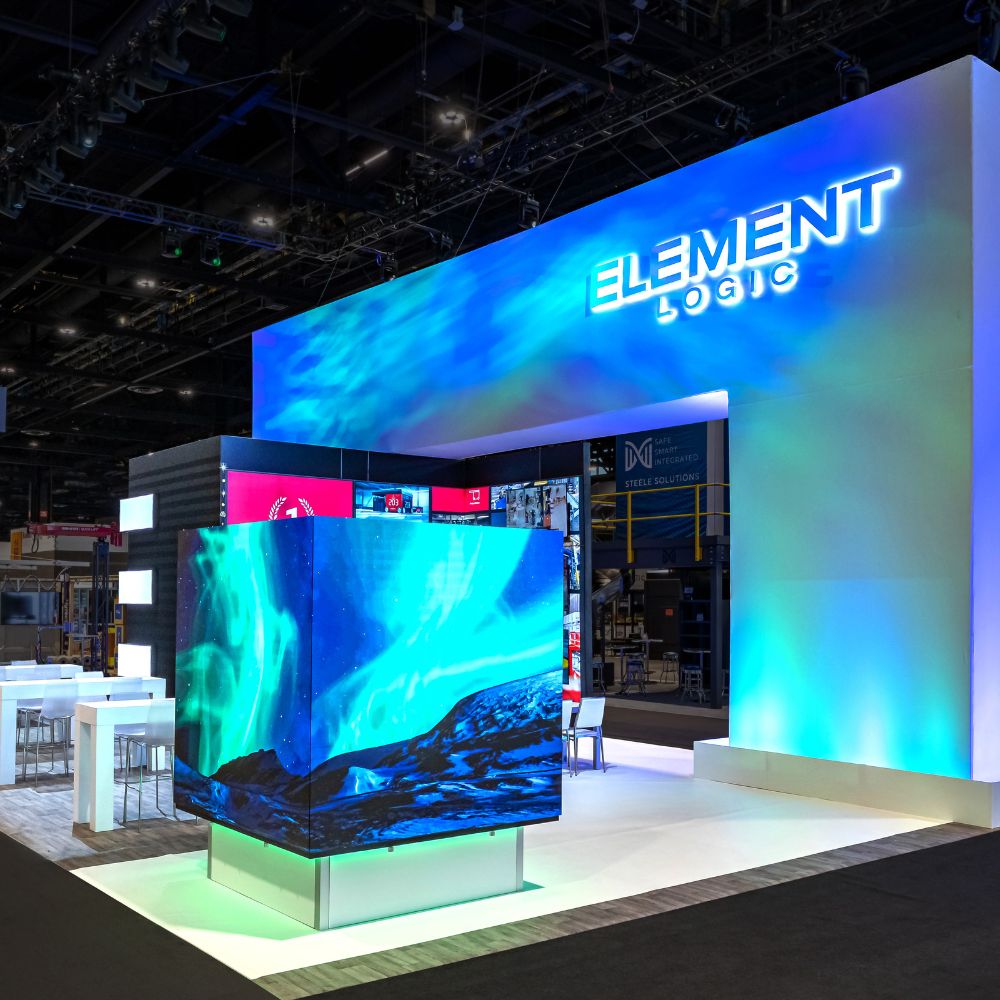 Exhibit Concepts award-winning modular exhibits at EXHIBITORLIVE 2025 and ProMat 2025, featuring immersive in-line timeline display and interactive rental booth with AR warehouse experience.