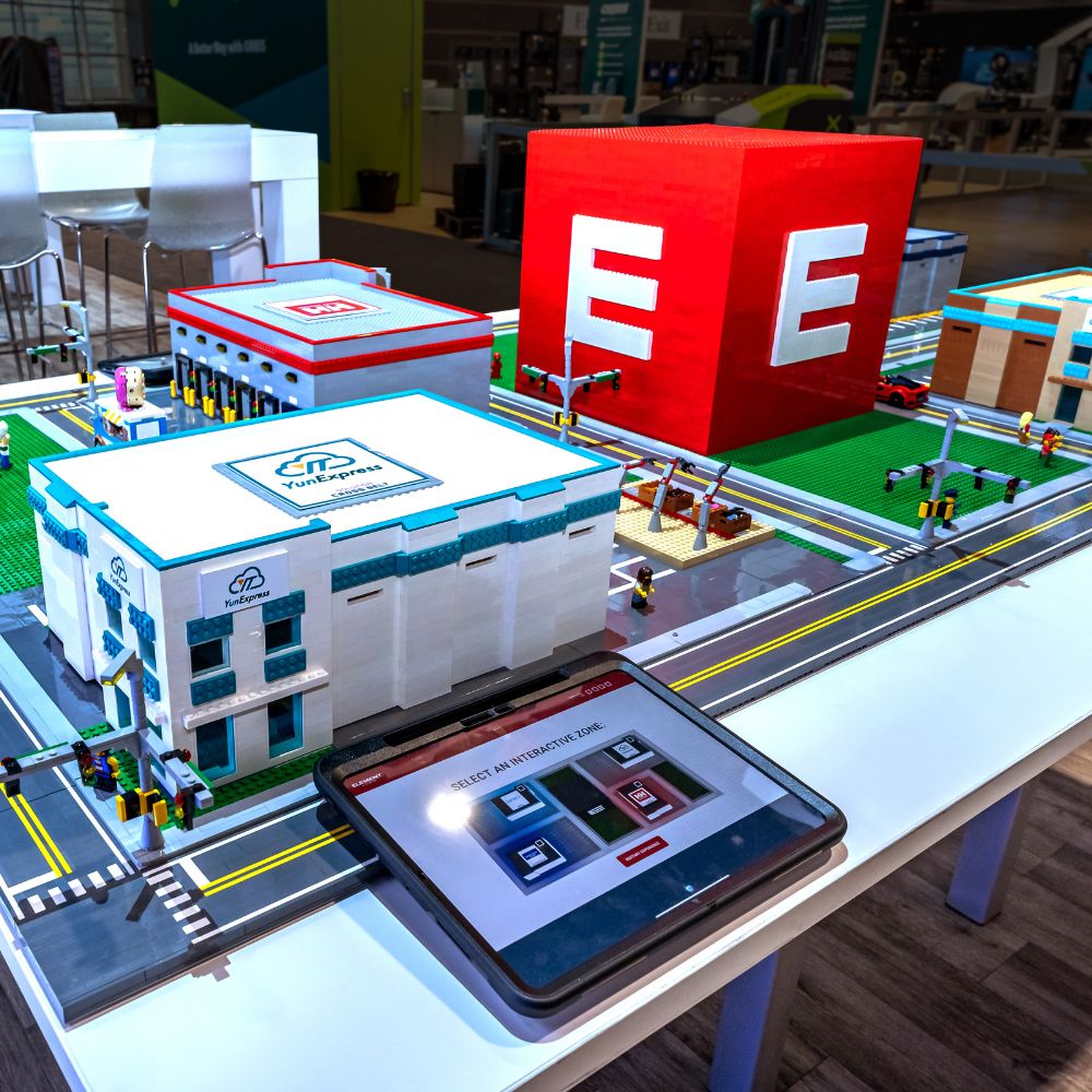 Exhibit Concepts award-winning modular exhibits at EXHIBITORLIVE 2025 and ProMat 2025, featuring immersive in-line timeline display and interactive rental booth with AR warehouse experience.